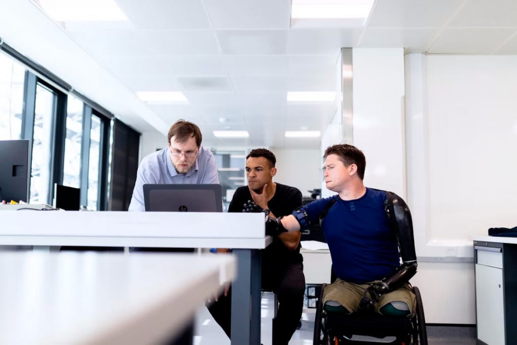 colleagues looking at laptop