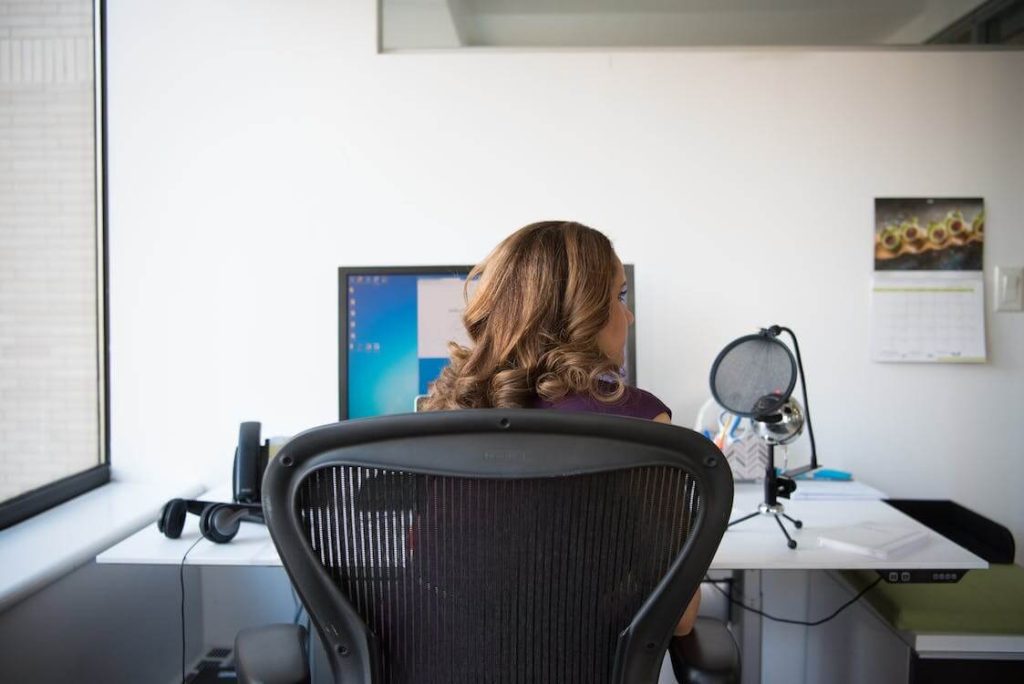 woman sitting at office workstation